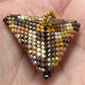 Unique beaded studio button by Lili Cantelmi.