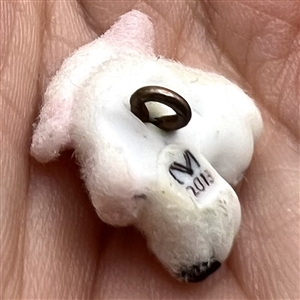 Mary Gaumond’s little lamb studio glass button.