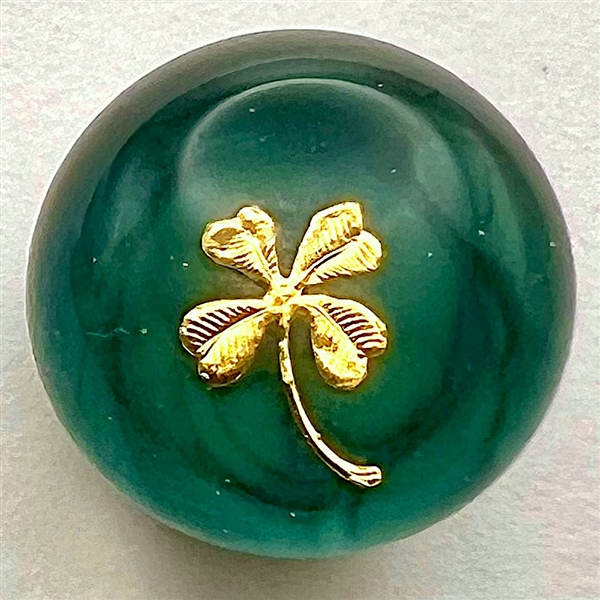 Glass paperweight studio button with clover by John Gooderham.