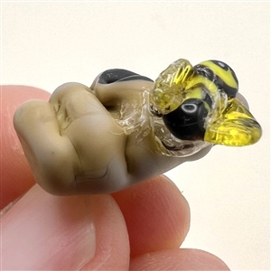 Mary Gaumond’s bee and hive studio glass button.