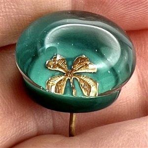 Glass paperweight studio button with clover by John Gooderham.