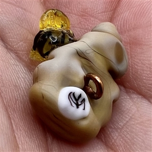 Mary Gaumond’s bee and hive studio glass button.