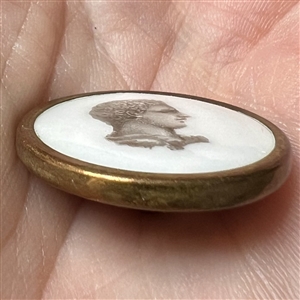 Liverpool transfer of man’s head on ceramic button.