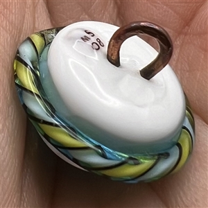 Studio glass button of a turtle by Mavis Smith.