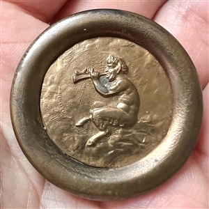 Stamped brass button of Pan piping.