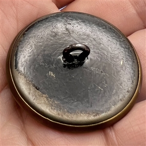 Stamped brass button of Pan piping.