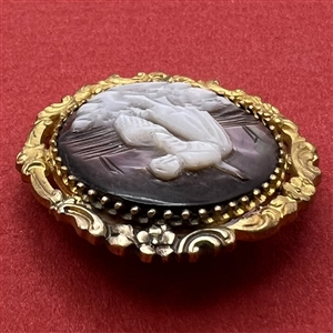Carved pearl button of woman gathering with a net.