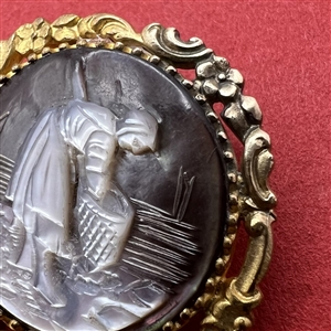 Carved pearl button of woman gathering with a net.