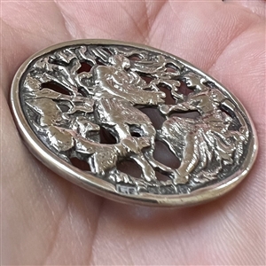 Hallmarked silver button of people with dogs.