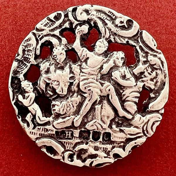 Hallmarked silver button of three women with a cherub.