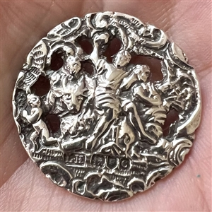 Hallmarked silver button of three women with a cherub.
