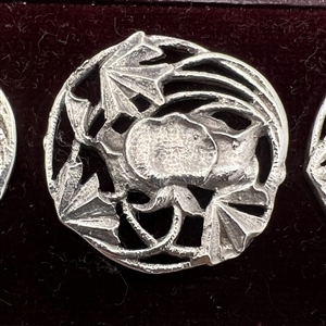 Set of 6 silver buttons of a flower in original box.
