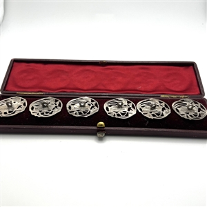 Set of 6 silver buttons of a flower in original box.
