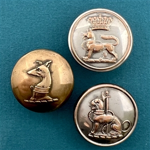 Three livery crest buttons of dogs.