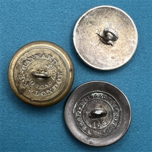Three livery crest buttons of dogs.