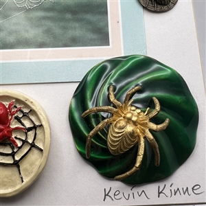 Card of ten spider buttons.
