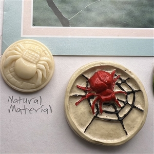 Card of ten spider buttons.