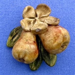 Painted sculptural plaster button of pears.