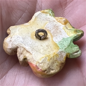 Painted sculptural plaster button of pears.