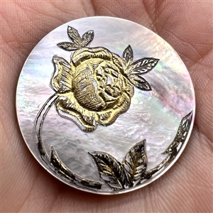 Pearl button with gold rose.