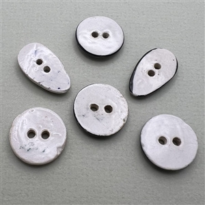 Six assorted hand-painted glazed ceramic buttons.