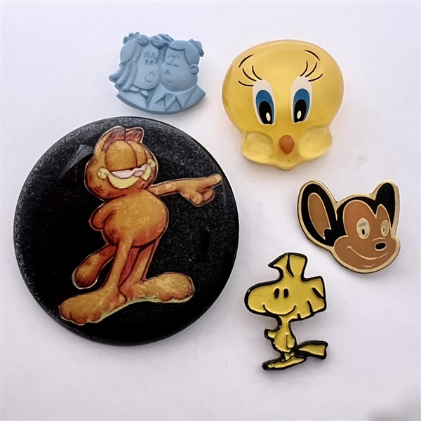 Five assorted cartoon character buttons. 