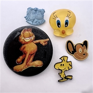Five assorted cartoon character buttons. 