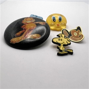 Five assorted cartoon character buttons. 