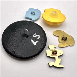 Five assorted cartoon character buttons. 