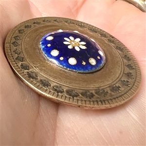 An 18th c. Copper button with enameled plaque center.