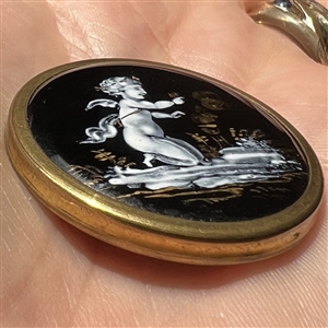 “En grisaille” enamel button of cupid blessing a couple.