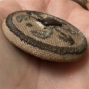 An 18th c. Transitional passementerie fabric button.