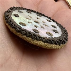 An 18th c. Fabric with pearl face button with glass and metal OME.