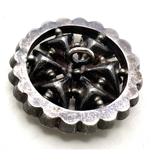 Edwardian jewel button with amethyst glass.