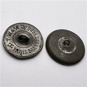Two buttons of men’s heads.