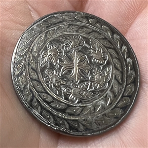 A 19th c. Steel button with cross and flowers.