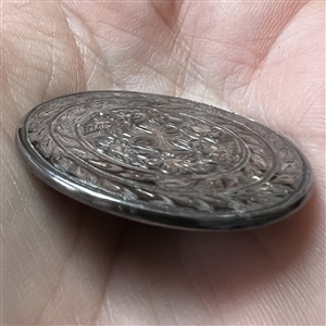 A 19th c. Steel button with cross and flowers.
