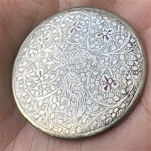 Persian button of a bird and an animal among flowers.
