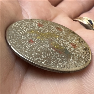 Persian button of a bird and an animal among flowers.