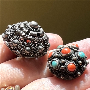 Two peasant silver buttons.