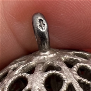 Two peasant silver buttons.