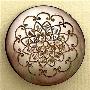 Grey pearl button with incised design of flower.