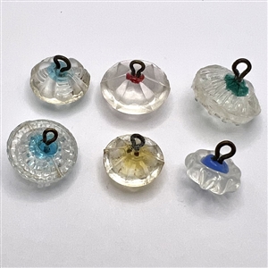 Six old glass radiant buttons.