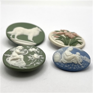 Four Jasperware studio buttons by Shaw and Rzanski .