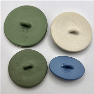 Four Jasperware studio buttons by Shaw and Rzanski .