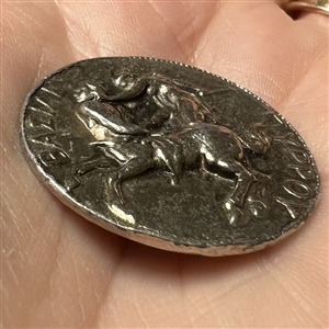 White metal metal button of man fighting a centaur by LIDZ.