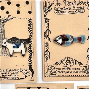 Five cards of “Hands Work” ceramic buttons of animals.