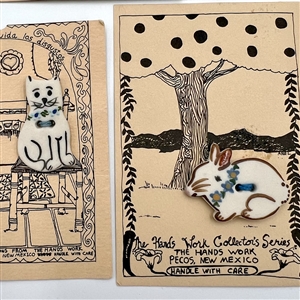 Five cards of “Hands Work” ceramic buttons of animals.