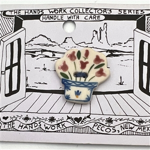 Four cards of “Hands Work” ceramic buttons of assorted subjects.