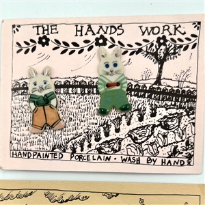 Six cards of “Hands Work” ceramic buttons of assorted subjects.